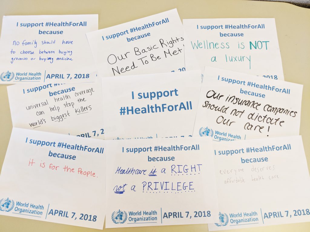 Handwritten signs in support of World Health Day's #HealthForAll